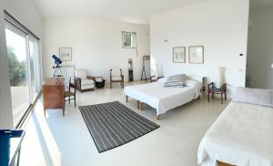 A bed or beds in a room at Stunning Design Villa with unique 180º sea views