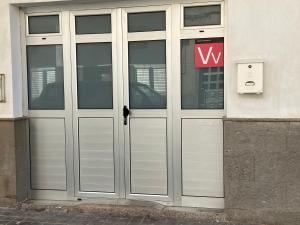 a door that is open in front of a building at Sarahs Kite Vivienda Vacacional en Playa del Burrero in Playa del Burrero