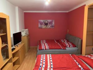 Postel nebo postele na pokoji v ubytování Apartmán Kvapil Lipová-lázně