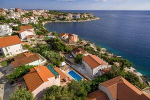 an aerial view of a village on the water at Villa Marina in Ražanj