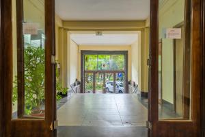 an open door leading to aoyer with a porch at Palace Cișmigiu Park in Bucharest