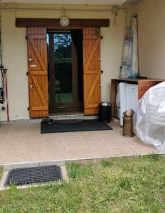 a front door of a house with a door at La Petite Jeannette in Lans-en-Vercors