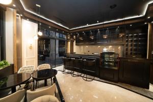 a kitchen with a table and chairs and a stove at Fama Karaköy in Istanbul