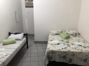 Voodi või voodid majutusasutuse Pousada Caravelas - Centro de Paraty toas