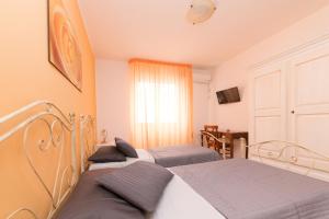 Postel nebo postele na pokoji v ubytování B&B La Casa nel Borgo