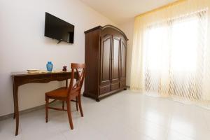 TV a/nebo společenská místnost v ubytování B&B La Casa nel Borgo