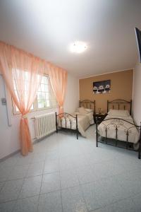 Postel nebo postele na pokoji v ubytování B&B La Casa nel Borgo