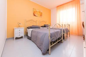 Postel nebo postele na pokoji v ubytování B&B La Casa nel Borgo