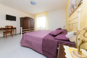 Postel nebo postele na pokoji v ubytování B&B La Casa nel Borgo