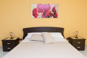 Postel nebo postele na pokoji v ubytování B&B La Casa nel Borgo