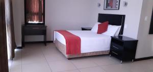 Ένα ή περισσότερα κρεβάτια σε δωμάτιο στο Comfy & Spacious Apartments