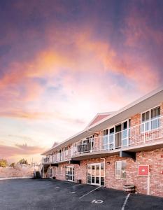 a building with a parking lot in front of it at Alexandra Heights Motel in Alexandra