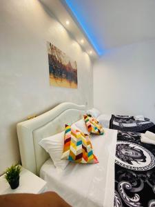 A bed or beds in a room at Santa Maria Accommodation