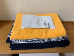 Postel nebo postele na pokoji v ubytování Ryokan Yamaichi