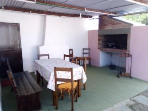 a dining room with a table and chairs and a fireplace at Tákate in Costa Azul