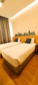 Postel nebo postele na pokoji v ubytování Qlio Hotel