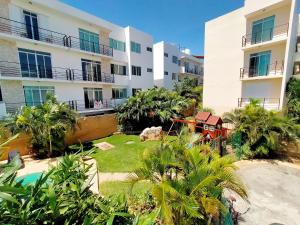 a view of the courtyard of a apartment building at Casa Punta Estrella in Playa del Carmen