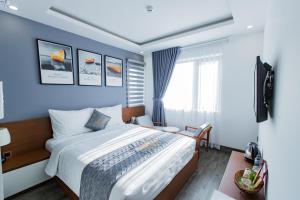 Voodi või voodid majutusasutuse Dang's Hotel toas