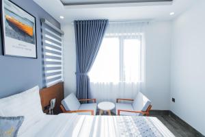 Voodi või voodid majutusasutuse Dang's Hotel toas