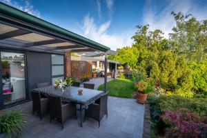 an outdoor patio with a table and chairs at Soul Vie Stay in Launceston