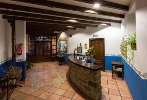 a lobby with a bar in a building at Hotel Villa de Cabrales in Arenas de Cabrales