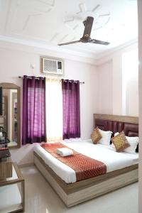 Ένα ή περισσότερα κρεβάτια σε δωμάτιο στο Hotel City Palace