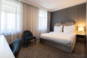 Кровать или кровати в номере Hartwell Hotel Москва Маяковская