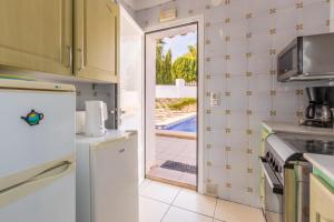 Kuchyň nebo kuchyňský kout v ubytování Villa Margarita