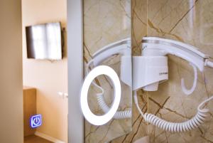 Ванная комната в Airport Garden Hotel