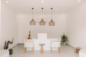 A seating area at RAW BEACH HOTEL