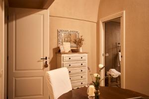 a room with a table and a dresser and a door at Borgo San Gaetano in Bernalda +37 photos