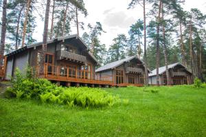 a large wooden house in the middle of a forest at Cheposh Park Altai in Cheposh