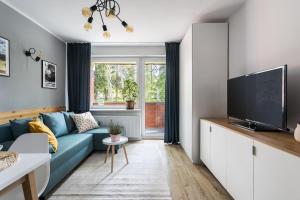 Televízia a/alebo spoločenská miestnosť v ubytovaní Rent like home - Żeromskiego 10
