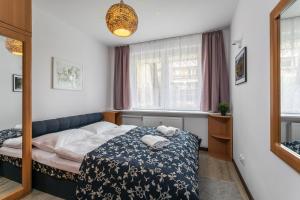 Posteľ alebo postele v izbe v ubytovaní Rent like home - Żeromskiego 10