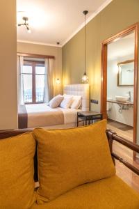 
Ένα ή περισσότερα κρεβάτια σε δωμάτιο στο Ef Zin Hotel Arachova
