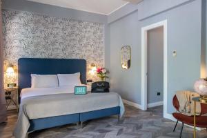 Voodi või voodid majutusasutuse Bloom Hotel Rome toas