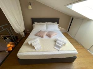 Posteľ alebo postele v izbe v ubytovaní Domus Suites Verona
