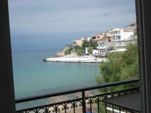 a view of a body of water from a balcony at Veroniki Apartment in Skala Marion