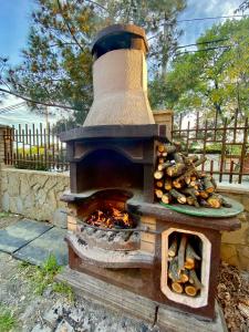 an outdoor oven with a plate of food in it at Мини-отель La Villa in Gelendzhik