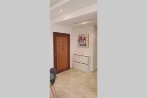 an empty room with a door and a hallway at Apartment Near & close to Casablanca Mohammed V International Airport in Nouaseur