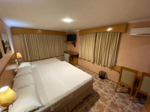 Postel nebo postele na pokoji v ubytování Ideal Praia Hotel + 37 fotografií