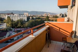 a balcony with a view of a city at Aatma Apartment in Skopje