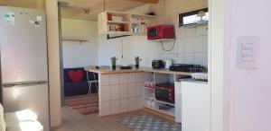 Kuchyň nebo kuchyňský kout v ubytování Tunquen Campomar Quincho y Piscina