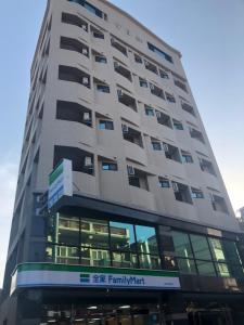 a tall building with a sign on it at Jin Zhan Hotel in Jincheng