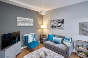 a living room with a couch and a tv at Host & Stay - 82 Galgate in Barnard Castle