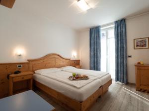 Postel nebo postele na pokoji v ubytování Hotel Garni Sottobosco