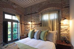 Ένα ή περισσότερα κρεβάτια σε δωμάτιο στο Hotel Doltso
