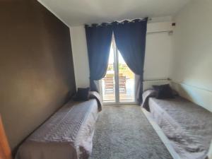 Postel nebo postele na pokoji v ubytování Guest House Brezza Marina