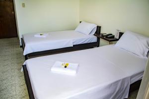 Giường trong phòng chung tại Hotel Centauros del Llano