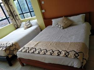 Ein Bett oder Betten in einem Zimmer der Unterkunft Hopewell Guest House